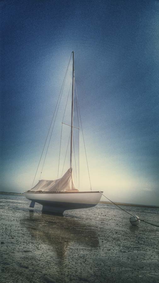 sail boat in the mud